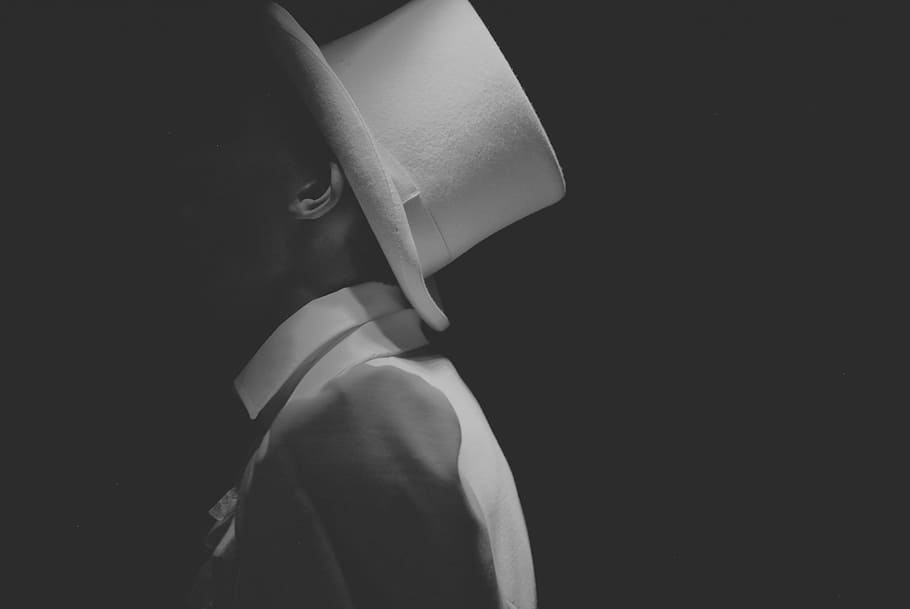 grayscale photo of man wearing fedora hat, black white, portrait