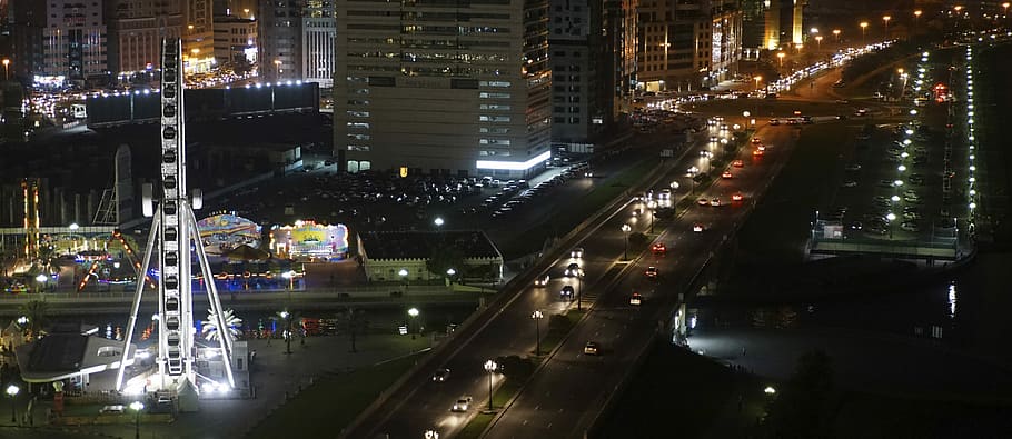 Eye of the Emirates and the Al Qasba Canal by night in Sharjah, United Arab Emirates