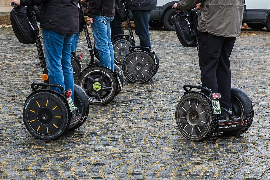 six persons riding on PT segway, motor, electrically, roller