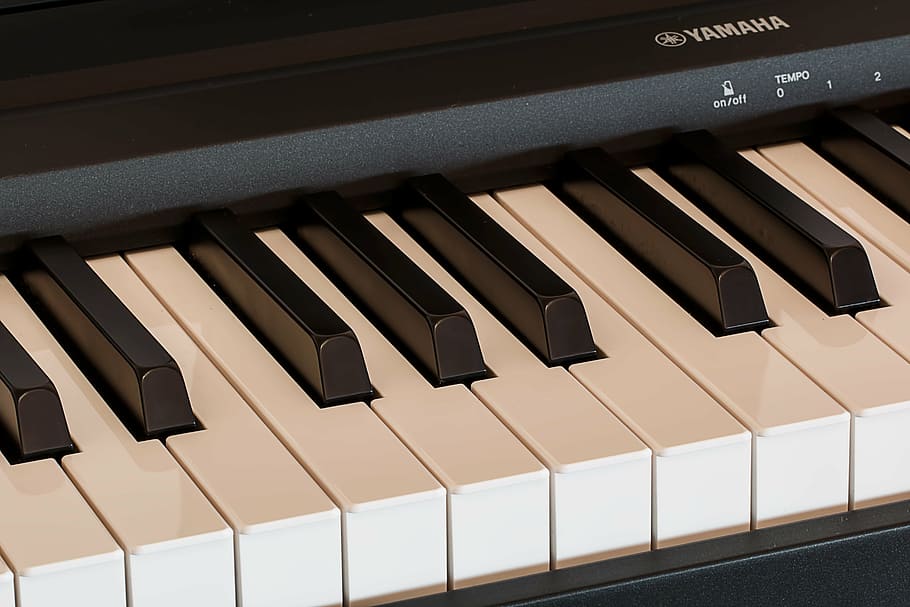 black Yamaha electric keyboard on black surface, piano, music