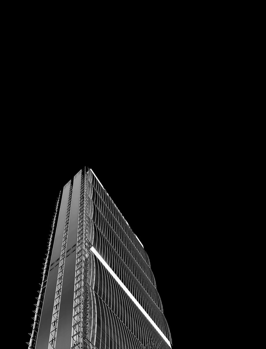 grayscale photo of high-rise building, low angle of lighted glass panel building HD wallpaper
