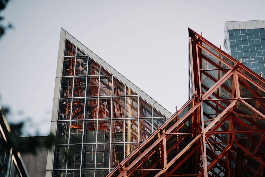 red and white structure, low-angle photography of high-rise building at daytime HD wallpaper