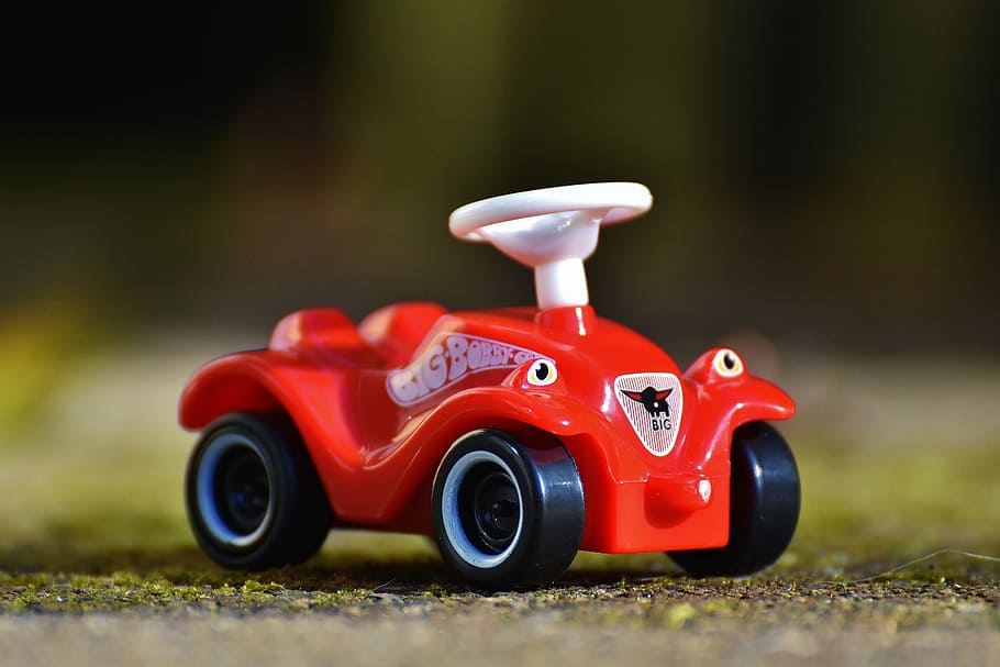 selective focus photography of red car plastic toy, Bobby Car