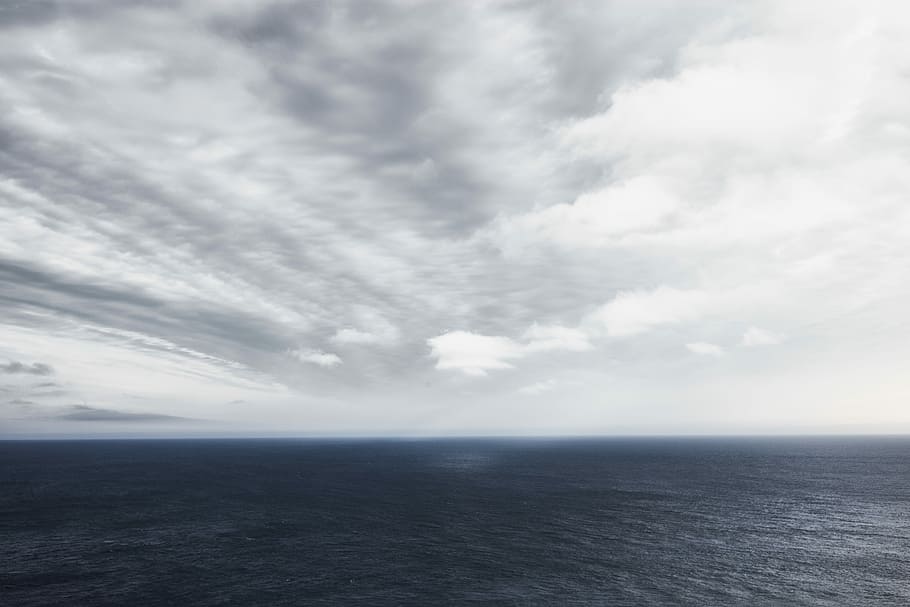 ocean below cloudy sky during daytime, body of water under cloudy sky during daytime HD wallpaper