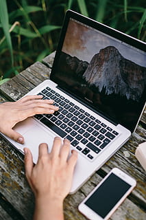 Man working on Macbook at lake, workspace, workplace, computer HD wallpaper