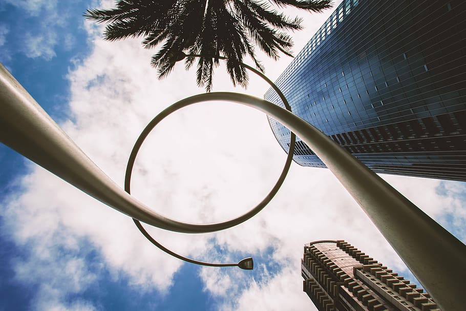 low angle spiral tower, low-angle photography of white street lamp under white clouds and blue sky during daytime HD wallpaper