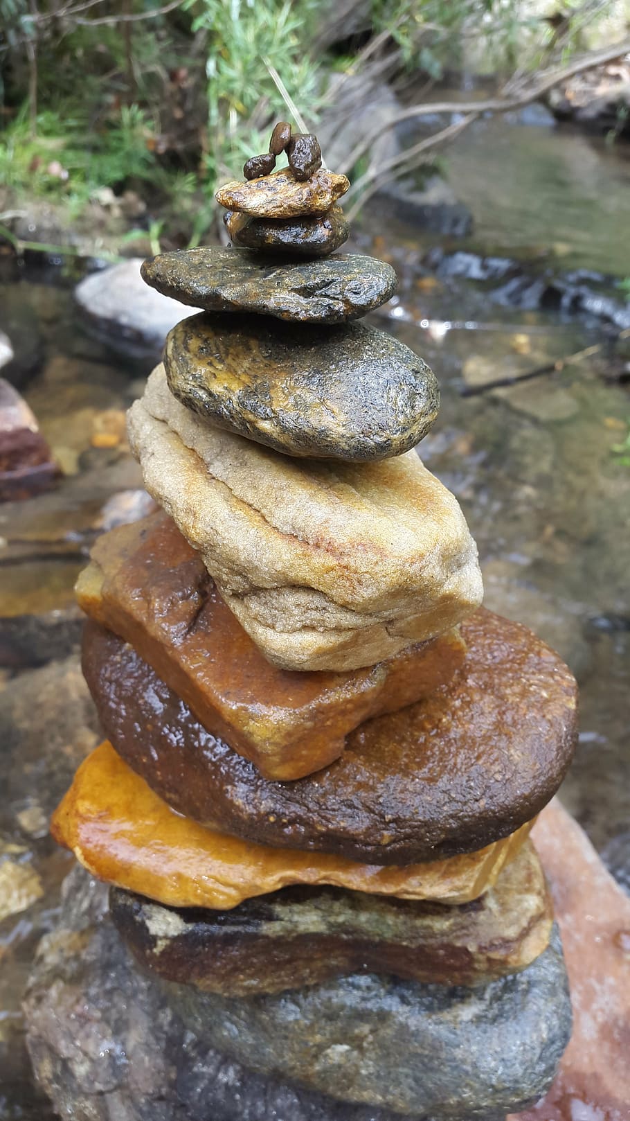 rocks, stack, balance, waterfall, close-up, focus on foreground HD wallpaper