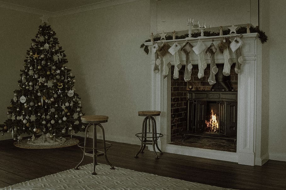 Christmas tree near two barstools at fireplace, turned on fireplace near Christmas tree, HD wallpaper