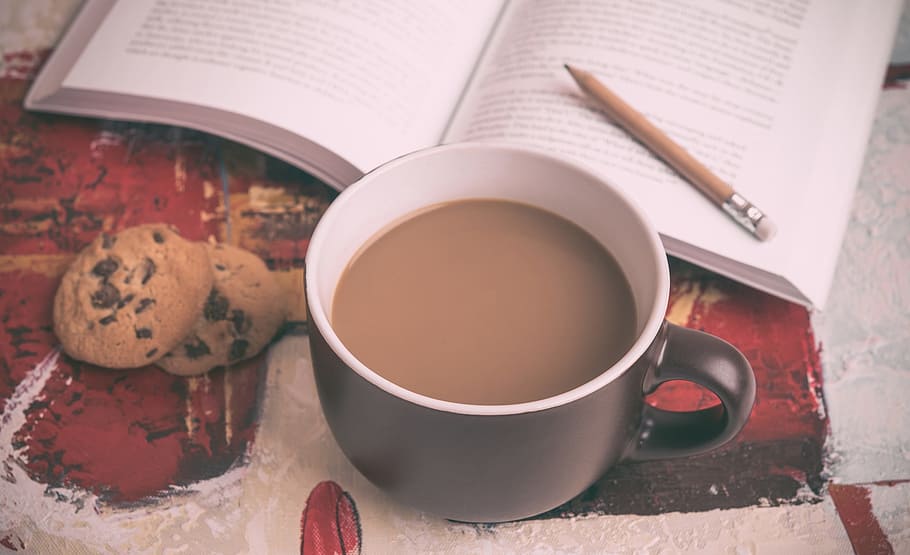 black mug filled with coffee beside open book and chocolate chip cookies, HD wallpaper