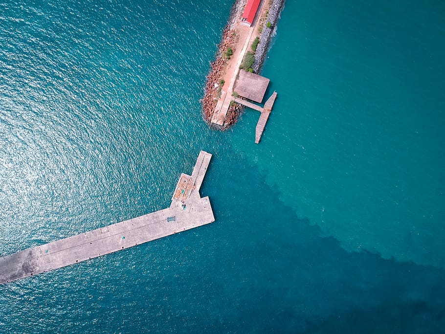 aerial photography on gray deck on the water, aerial photo of island