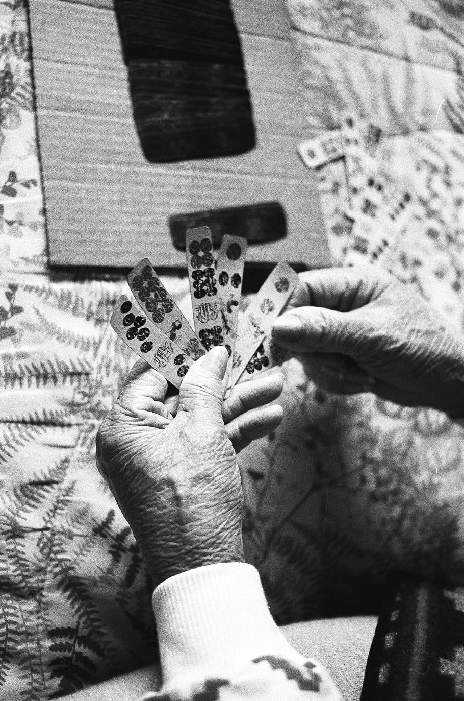 grayscale photo of person holding game chips, person holding cards HD wallpaper