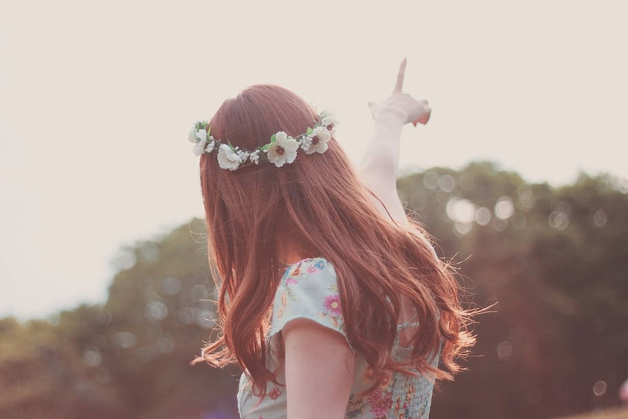 woman pointing on sky in selective focus photography, outdoors HD wallpaper