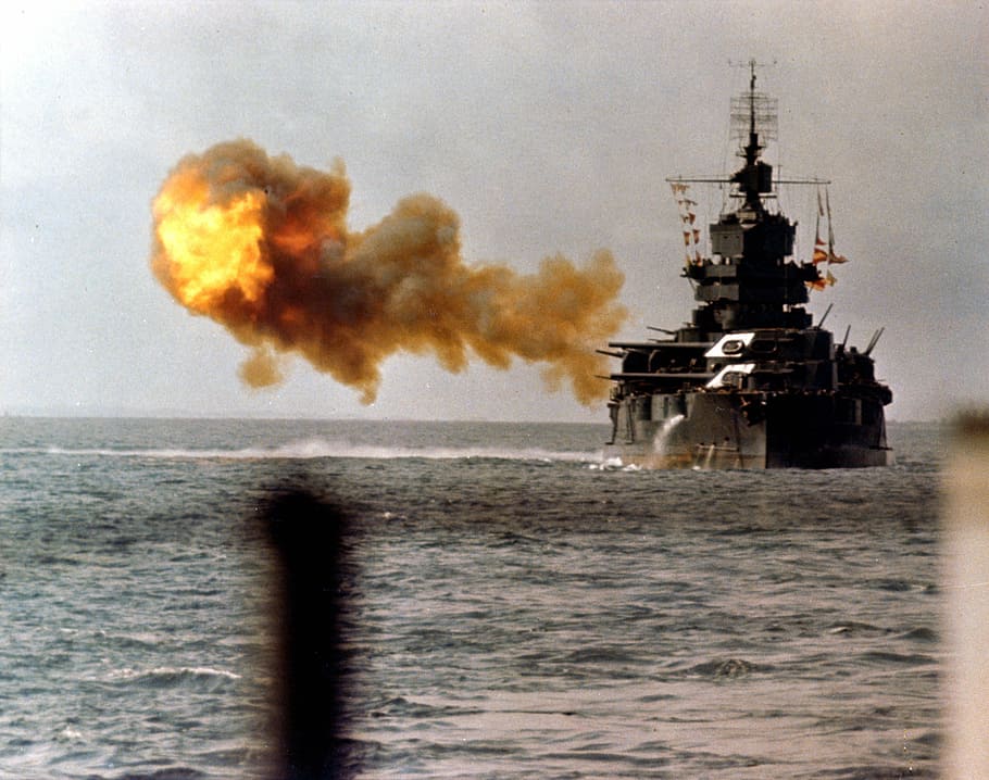 The battleship USS Idaho shells Okinawa in World War II, fire