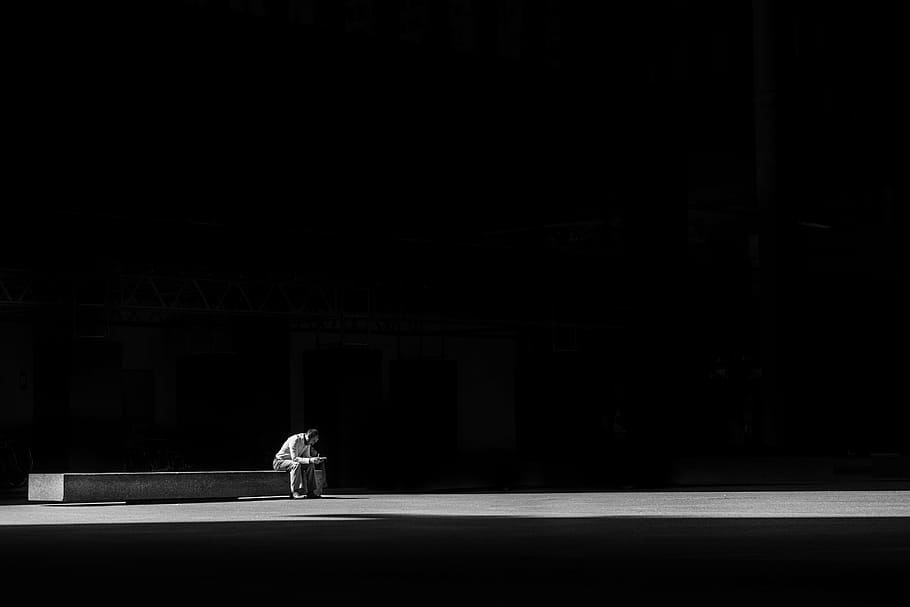photo of man sitting on concrete plain, dark, light, person HD wallpaper