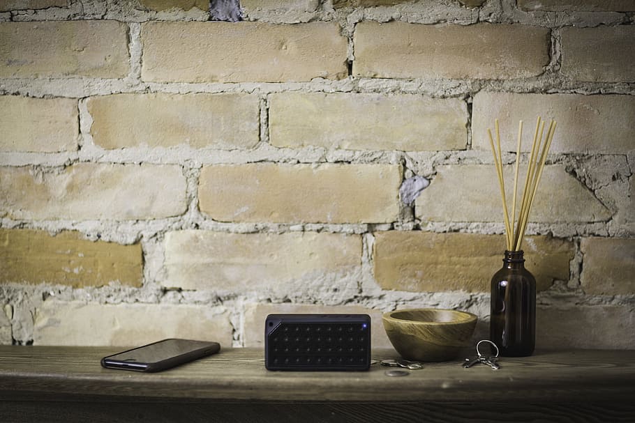 black smartphone on desk, bluetooth, speaker, electronic, technology HD wallpaper
