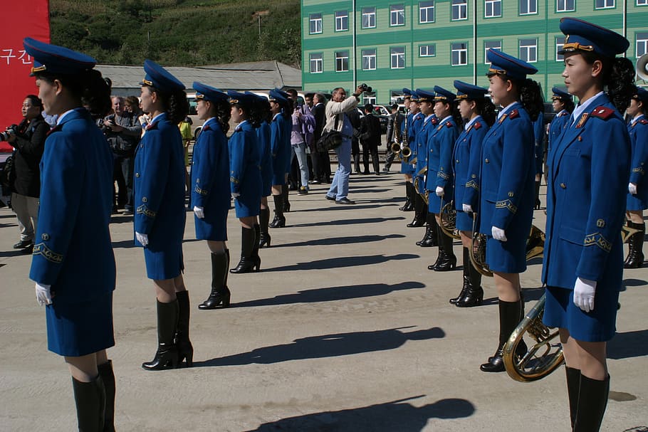 police women standing at daytime, parade, north korea, music