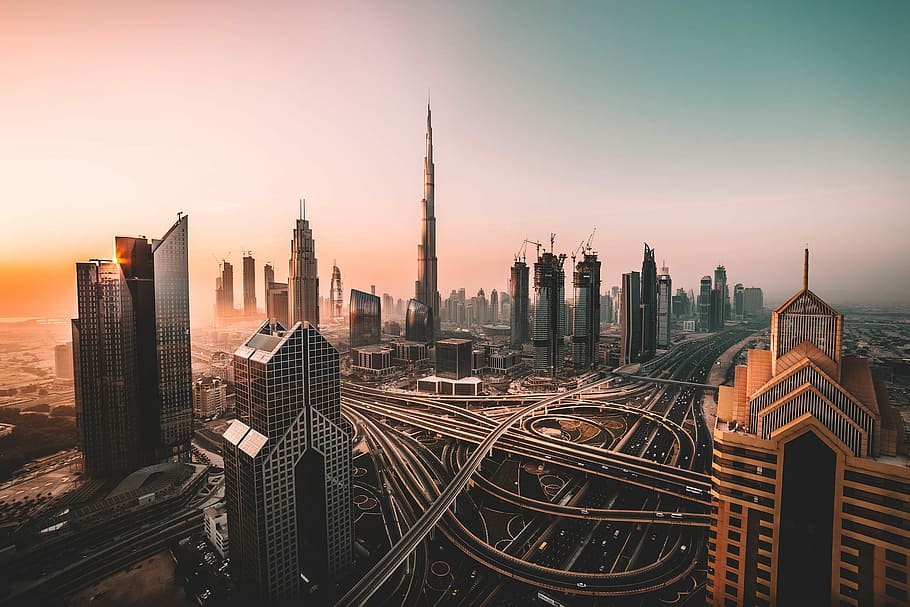 aerial photo of city highway surrounded by high-rise buildings, aerial photography of buildings and bridges during daytime HD wallpaper