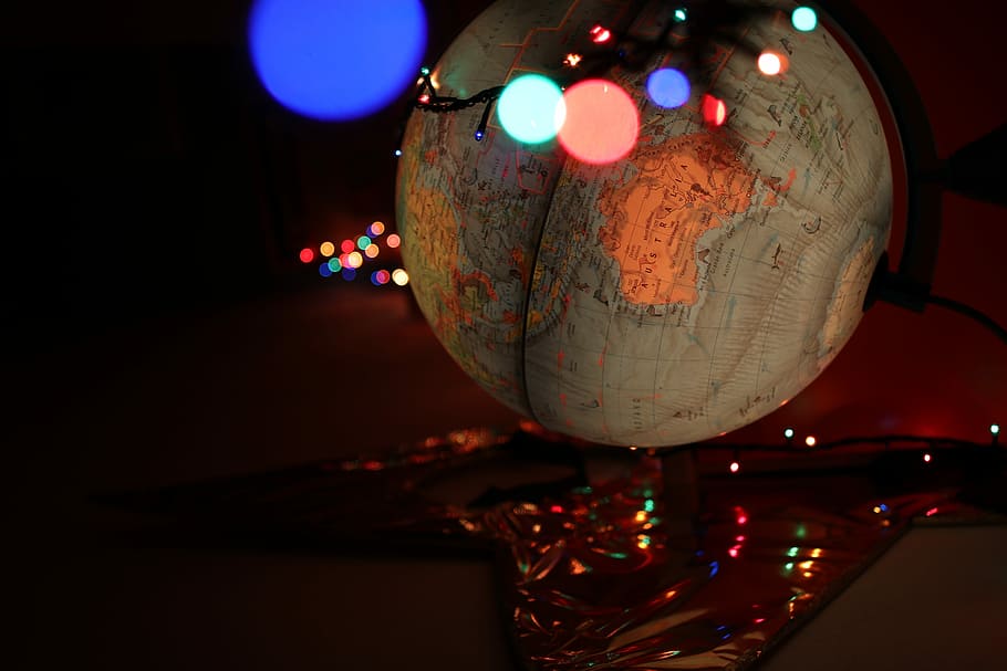 bokeh photography of desk globe, map, lights, fairy light, illuminated HD wallpaper