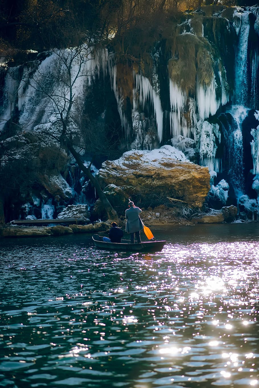 two person on boat near rock, bosnia and herzegovina, cave, mountain