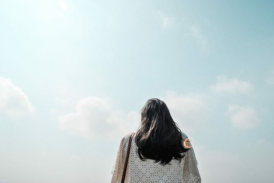woman standing under cloudy sky during daytime, person wearing white top under blue sky, HD wallpaper