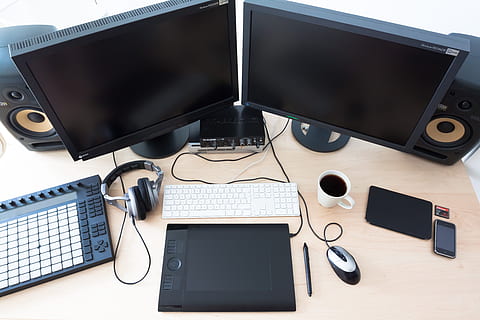 two black flat screen computer monitor on brown wooden table HD wallpaper