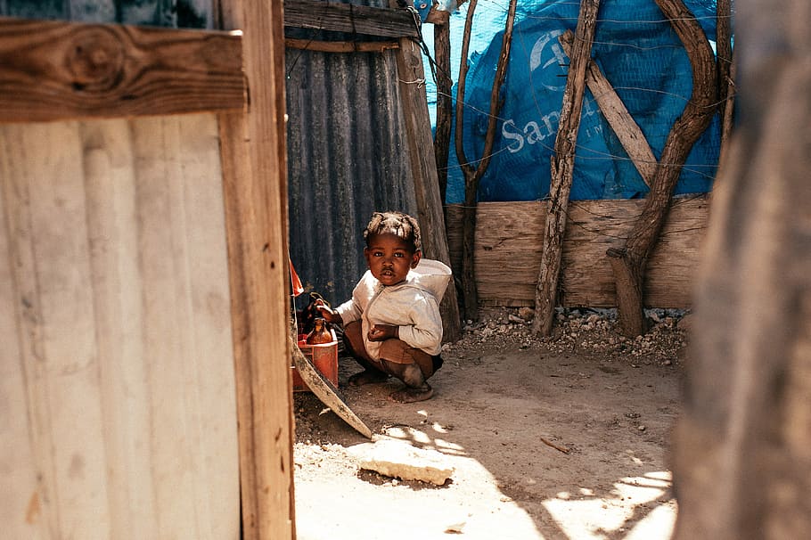 A child squatting in the dust, child near galvanized sheet, person, HD wallpaper
