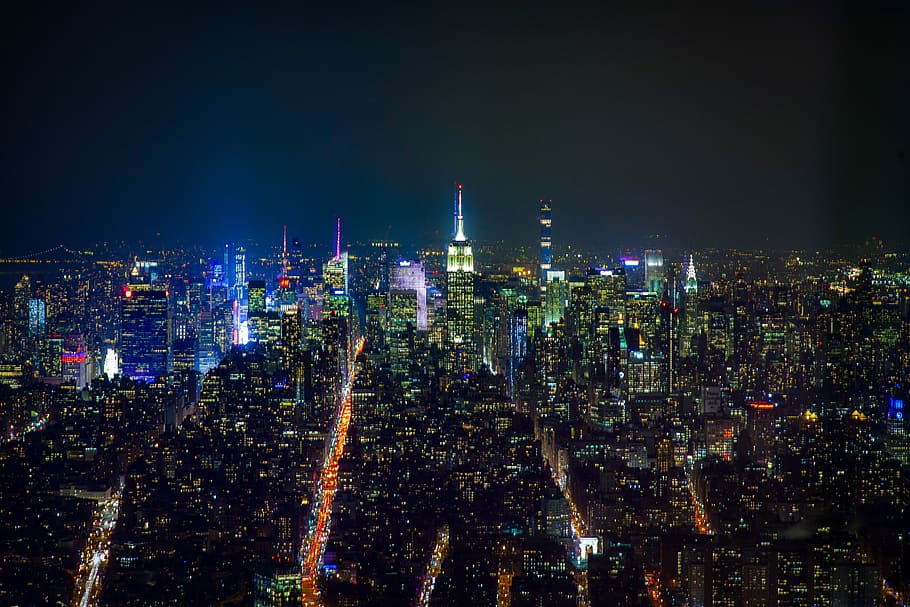 aerial view of buildings during night time, city skyline at night