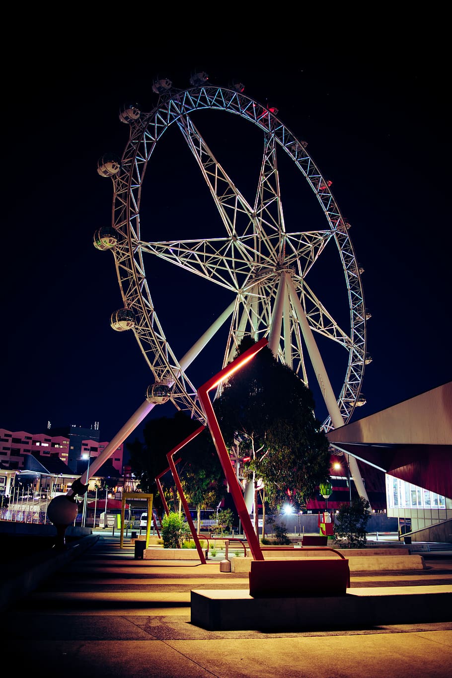 low angle photo of white and red ferris wheel, photo of white ferris wheel during night time