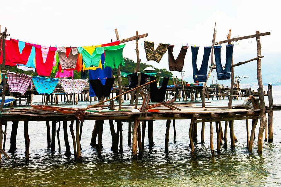 assorted-color clothes hanging above dock, washing, line, pier