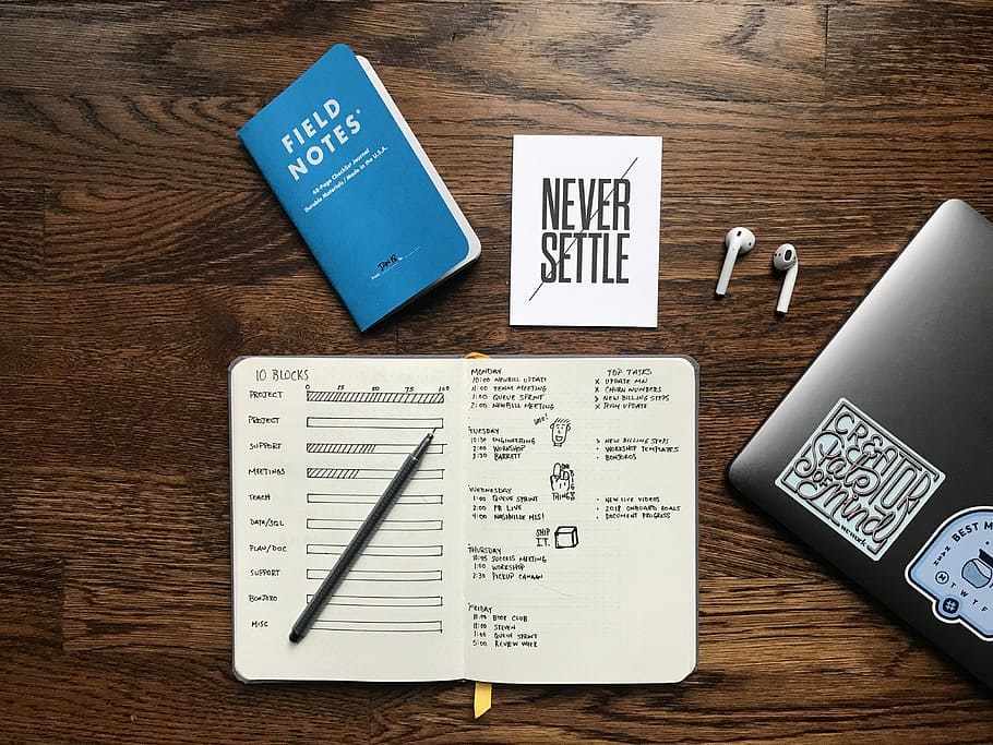 Apple AirPods near MacBook, Field Notes' book, notebook, pen HD wallpaper