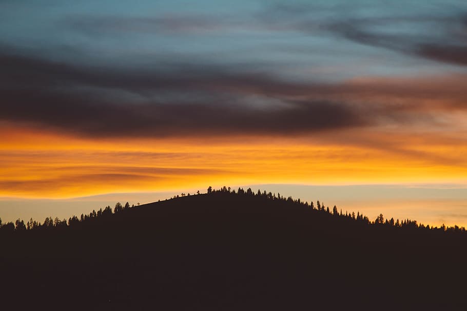 black mountain at daytime, silhouette of hill and orange sunset HD wallpaper