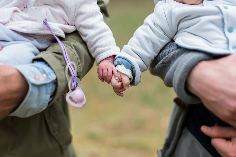 two babies holding each others hands, kids, parents, husband