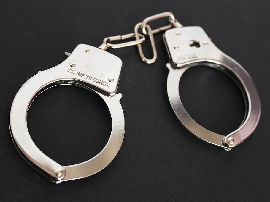 silver handcuffs on black surface, gray, metallic, chains, prison