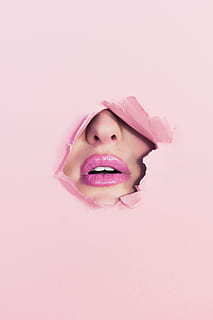 woman with pink lipstick on hole of pink paper, women's lips wallpaper HD wallpaper