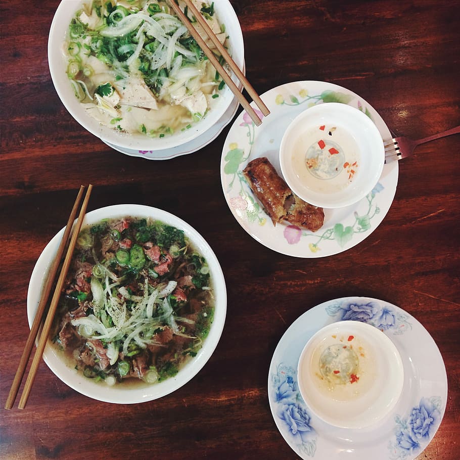 Pho Bo and Pho Ga in a restaurant, soup, spring roll, top view HD wallpaper