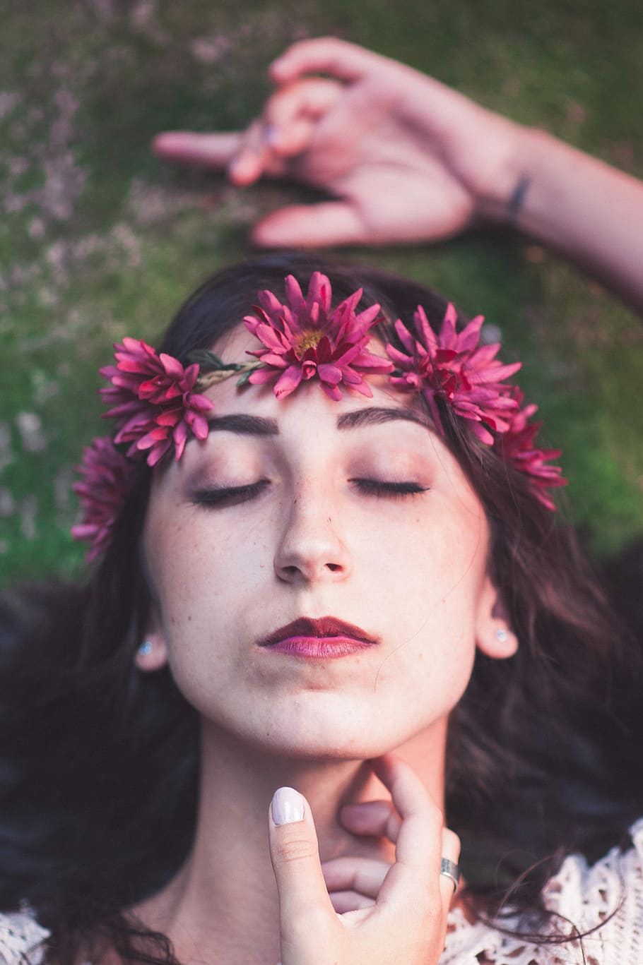 woman wearing pink floral headdress portrait selective focus photography, shallow focus photo of woman closing her eyes with pink flower crown