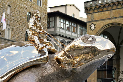 man riding tortoise statue, giant, turtle, gold, shiny, chrome HD wallpaper