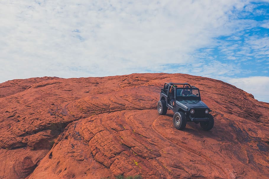 Hd Wallpaper Black Jeep Wrangler On Hill Black Jeep Wrangler On Top Of Brown Rock Under Blue Sky And White Clouds Wallpaper Flare