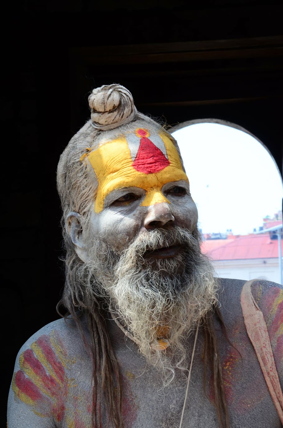 man with yellow and red painted face portrait photo, nepal, holy, HD wallpaper
