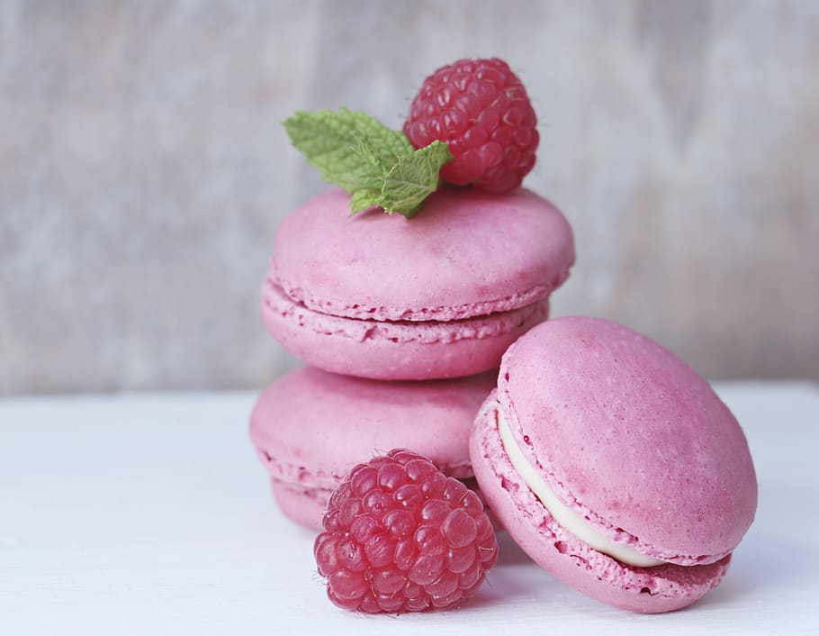 three strawberry macarons, raspberries, mint, pastries, french pastries