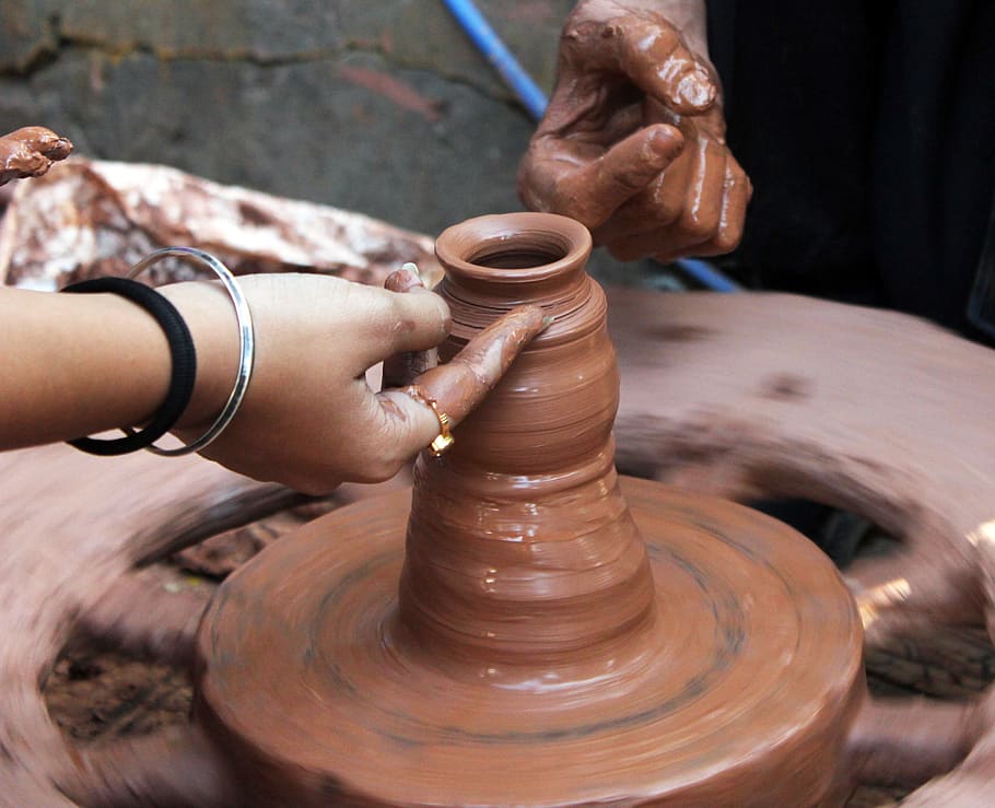 person pot making during daytime, pottery, clay, craft, handmade