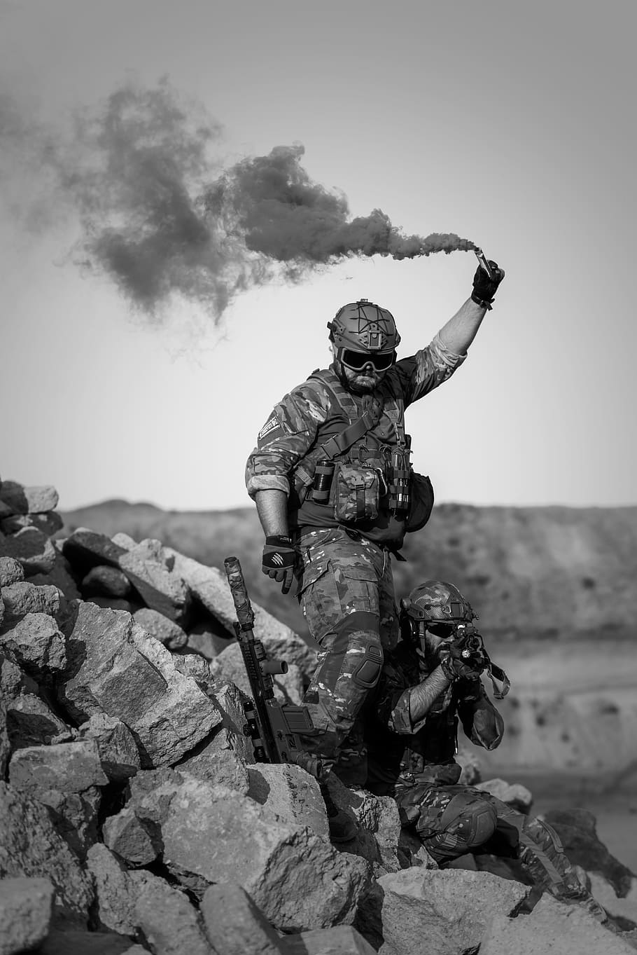 male standing on rock, war, desert, gunshow, soldier, action