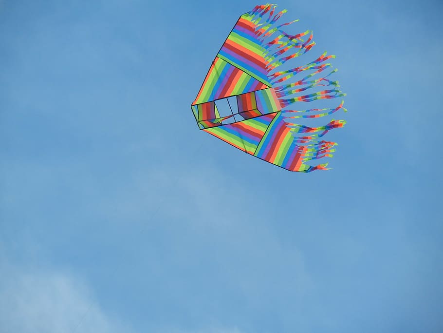 low-angle photography of multicolored kite under clear sky at daytime HD wallpaper