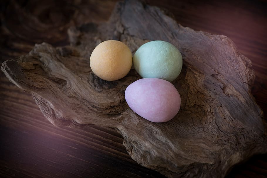 closeup photo of three egg bath bombs on wood bowl, chocolate eggs HD wallpaper
