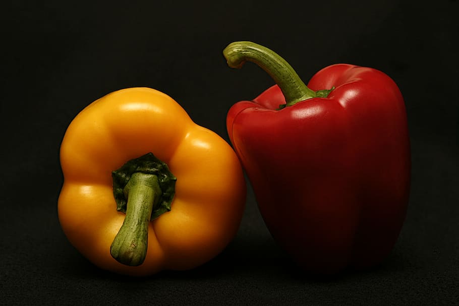 two red and yellow bell peppers, black, surface, food, cook, spice, HD wallpaper