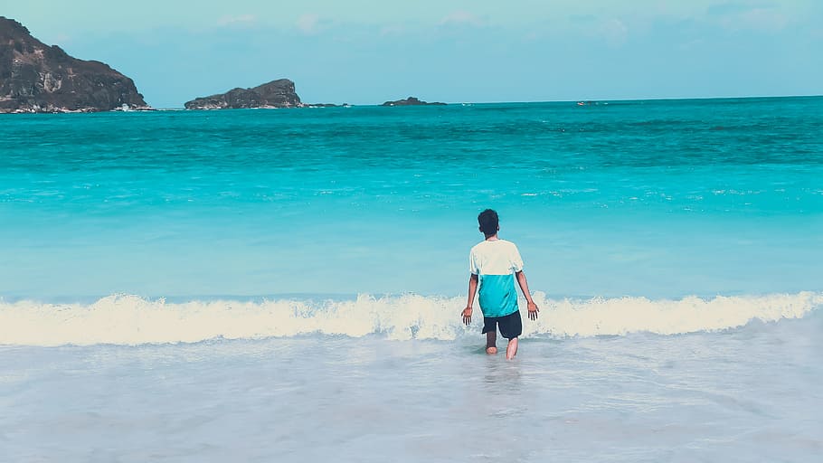 Photo of Man Walking by the Seashore, beach, boy, calm, enjoyment HD wallpaper