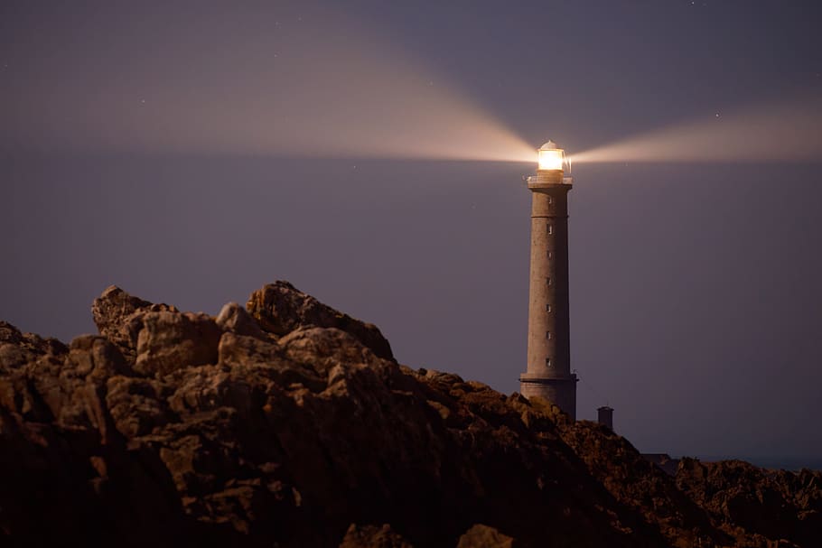 turned on lighthouse, rocks, hill, landscape, cliff, mountain HD wallpaper