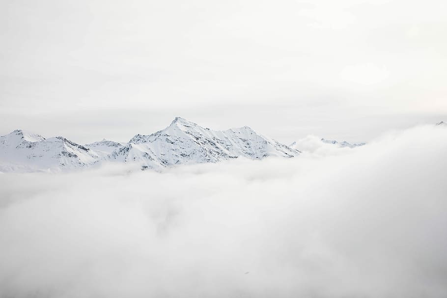 mountain range covered with snow and clouds at daytime, white mountain during daytime HD wallpaper