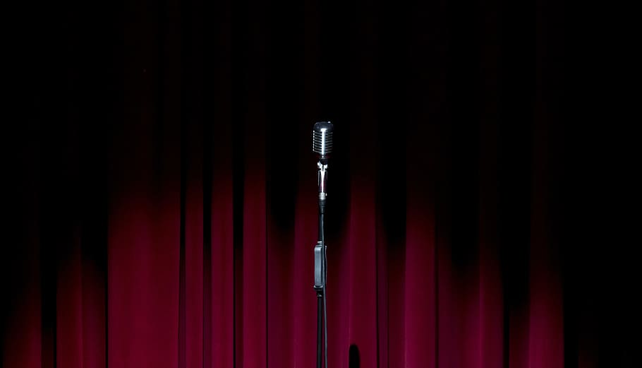 black microphone near red curtian, stage, curtain, old microphone