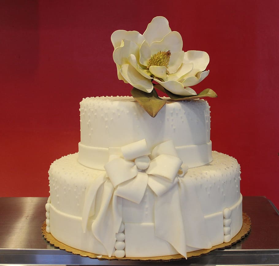 white fondant cake with petaled flower on top placed on gray surface HD wallpaper